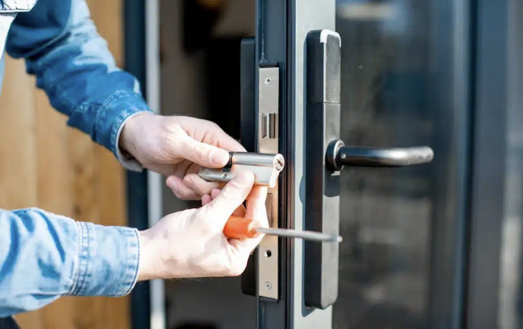Locksmith installing a new euro-cylinder lock on a glass front door in Northern Rivers NSW